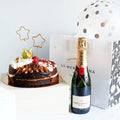 Tarta, champaña, globo y vela